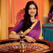 Live-dealer multi-camera studio setup with card tables and professional dealers